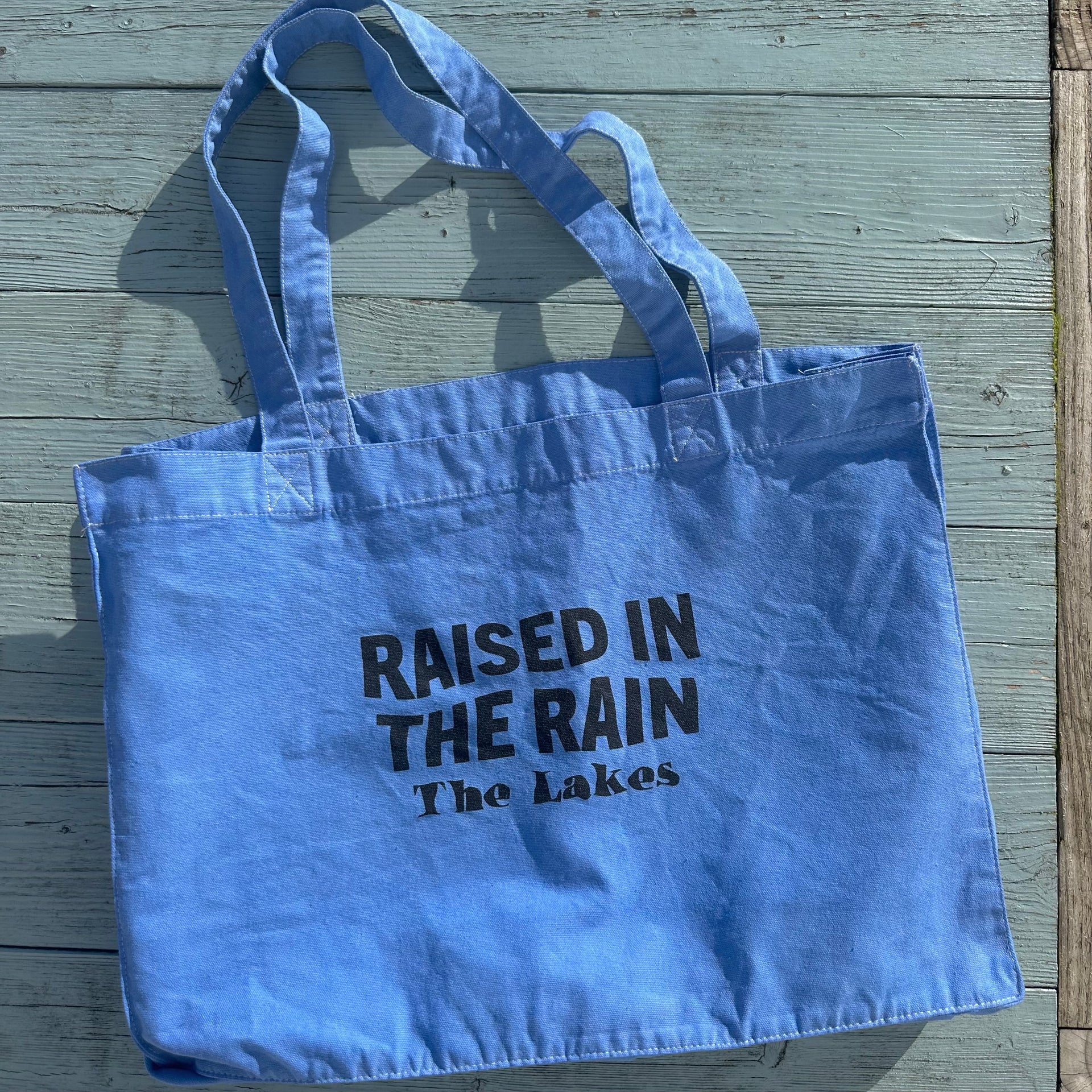 it's in the bag the rain Raised In The Rain Tote Bag