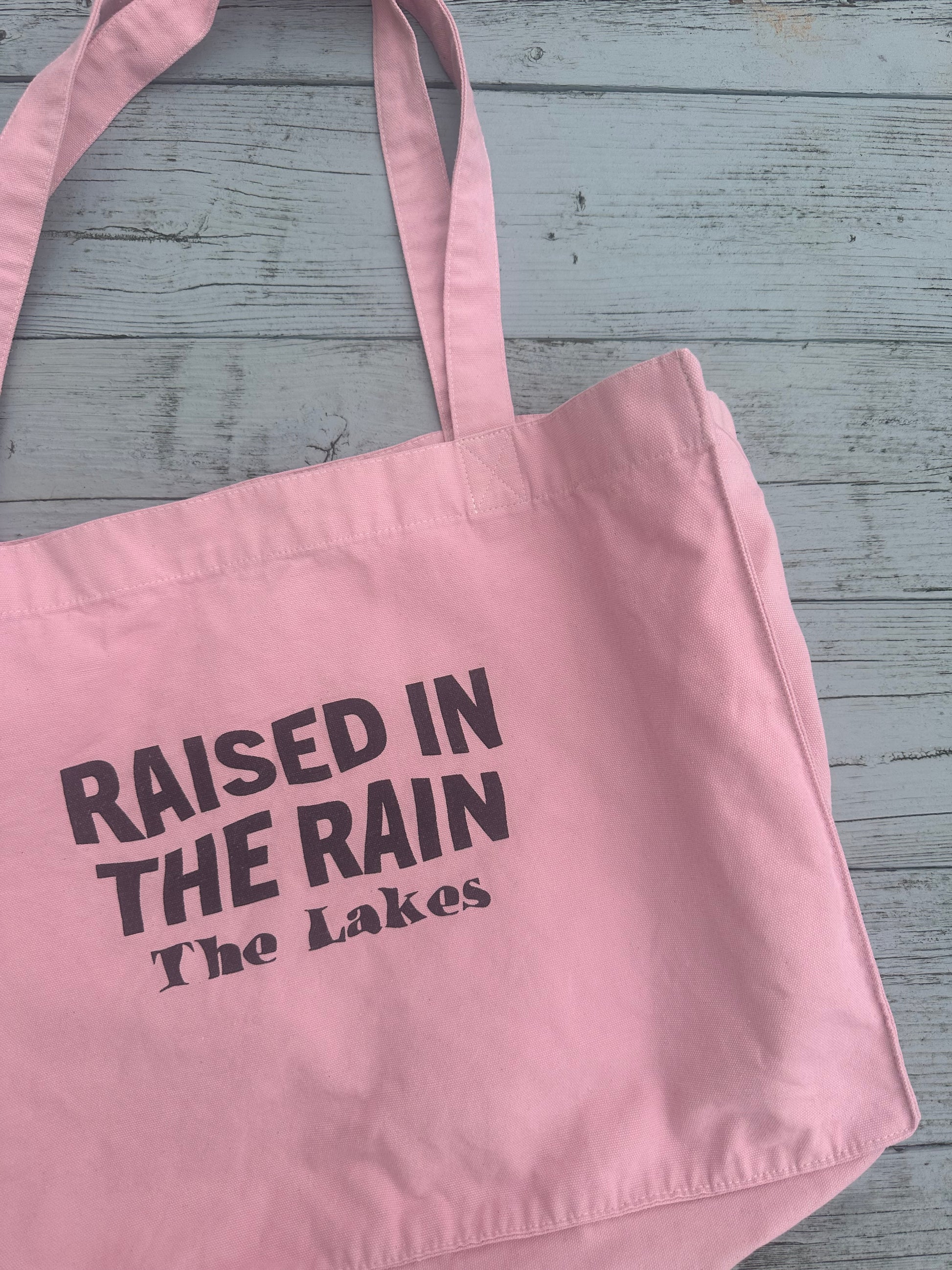 it's in the bag the rain Raised In The Rain Tote Bag
